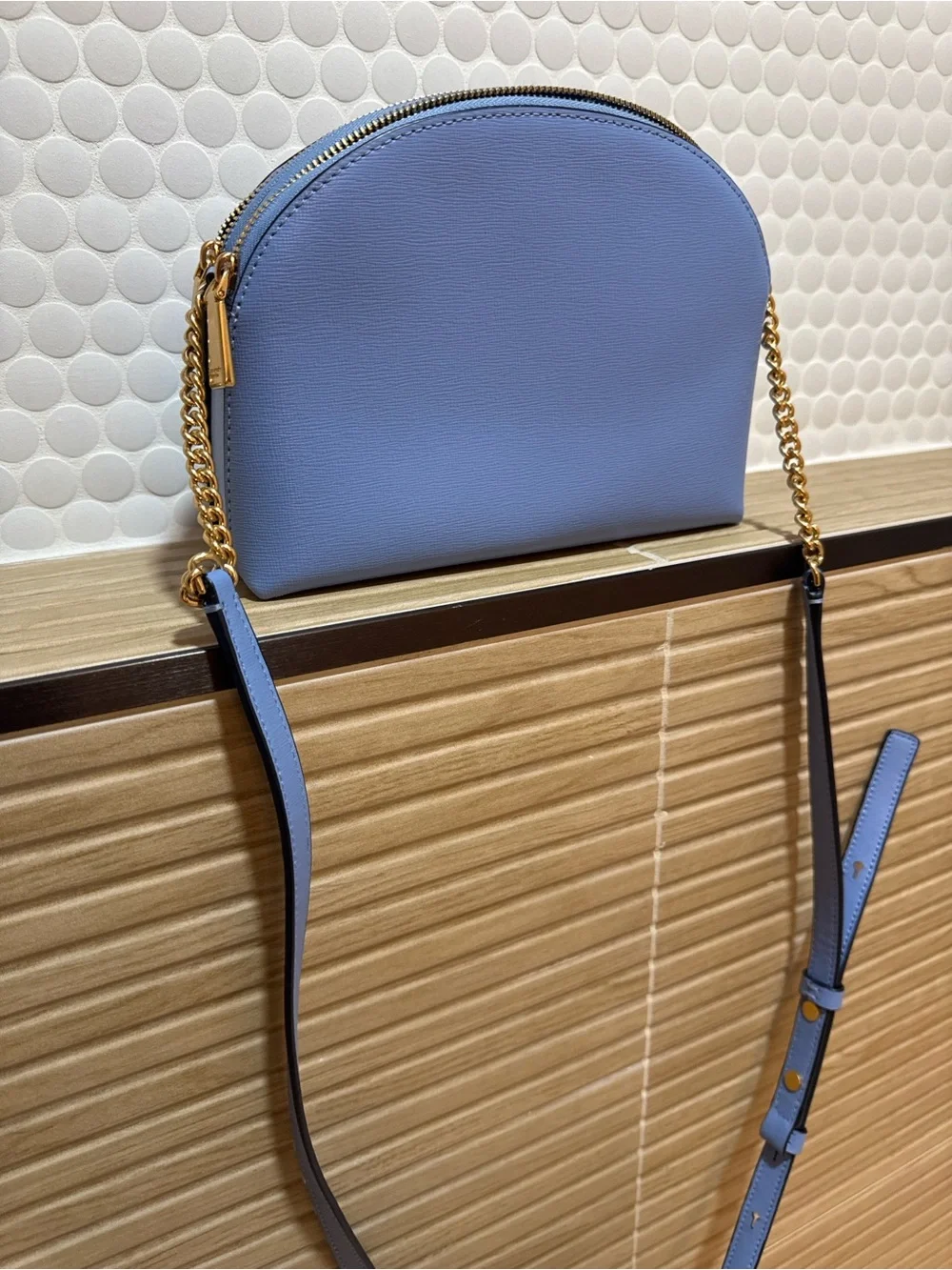 kate spade small dome crossbody in powder blue with gold hardware